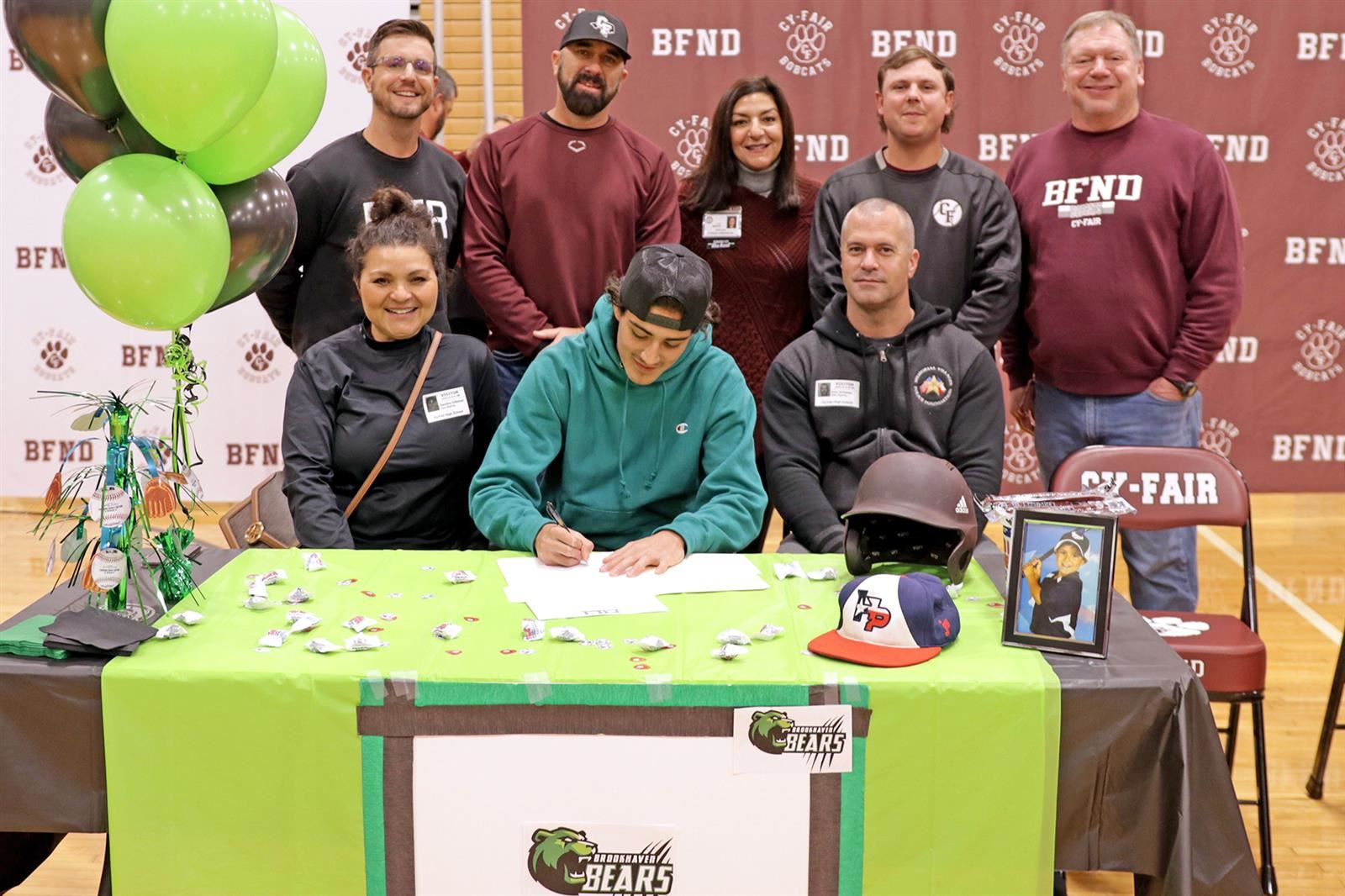 Cy-Fair High School senior Absalom Aranda, seated center, signs his letter of intent to play baseball at Brookhaven College. 